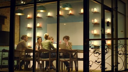 Business people talking in creative space. Woman leaving meeting room.