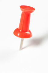 Red pushpin isolated on white background