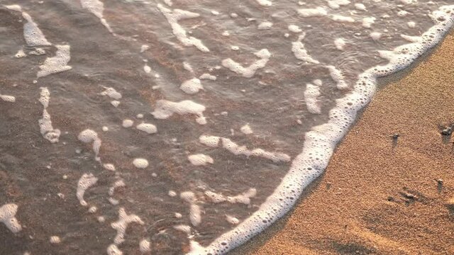 We're leaving behind a very bad year. 2020 written on the beach disappears into the waves. Goodbye 2020 welcome 2021