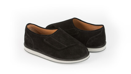 children's black orthopedic shoes on a white background