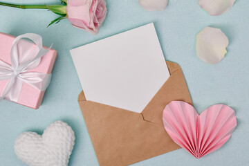 Envelope on a background of roses and cerd. a romantic letter. Valentine's Day