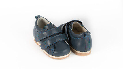 children's blue orthopedic shoes on a white background