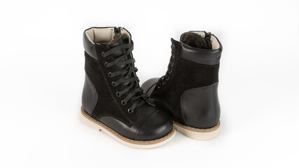 children's black orthopedic shoes on a white background