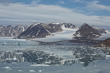 Mountains, glaciers and coastline landscape close to a village called 