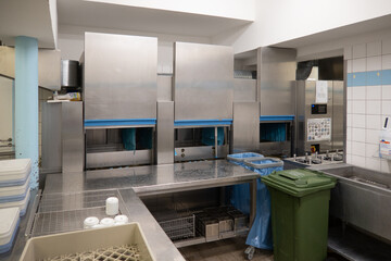 in  hospital kitchen there is a dish washing line