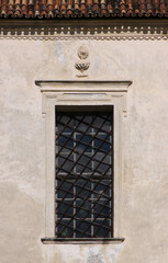 Window and cornice on the baroque facade of the church of Our Lady on the Bichl in the historical village of Latsch, South Tyrol in Italy © float
