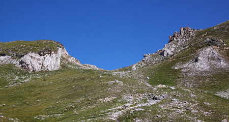 Göflaner Schartl mountain pass and rock formations at a hiking trail in the Alps seen from the...