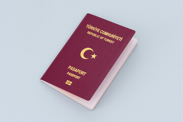 Turkish citizen public passport on the gray background.