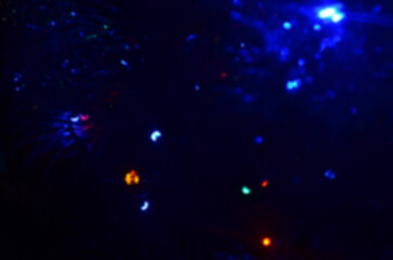 Bright, glowing garland in the dark, multi-colored balls. New Year, decorations for the Christmas tree.