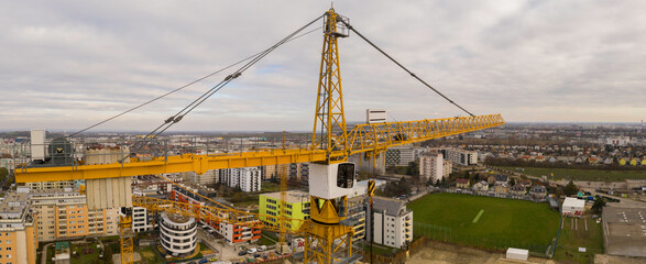Drone shot of a crane working on a construction site