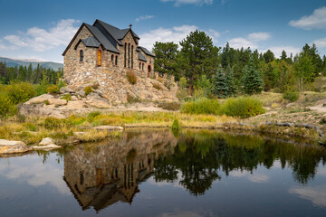 Fototapeta na wymiar St Catherines Chapel on the Rock Church in the Rocky Mountains of Colorado, reflection in lake