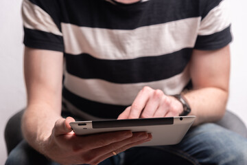 young man using digital tablet and reading news, Home work or study, freelance, online shopping, distance education,