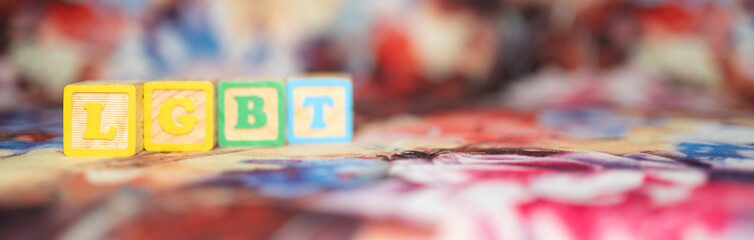 alphabetical letters placed on colored wooden cubes forming the word LGBTQ