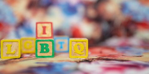 alphabetical letters placed on colored wooden cubes forming the word LGBTQ
