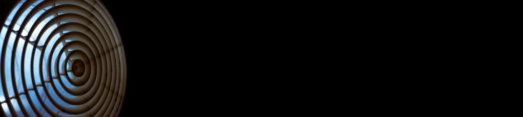 ventilation grill diffuser close-up mounted in the duct at night, the front and background are blurred