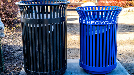 Blue metal recycle bin the park