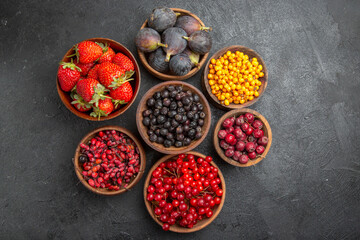 top view different fresh fruits inside plates on dark background fruit color photo many mellow juice