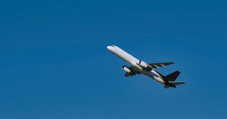 Fototapeta na wymiar Jet airplane in the blue sky