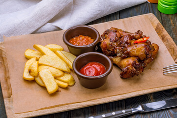 chicken wings in barbecue sauce on the board