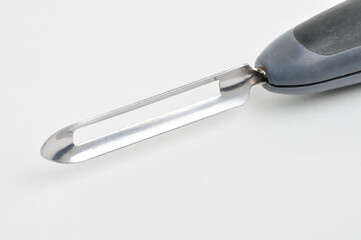 Fruit and vegetable scraper on a white background
