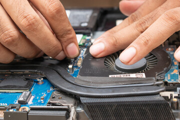 Obraz premium joining and repairing fan and mother board of gaming laptop