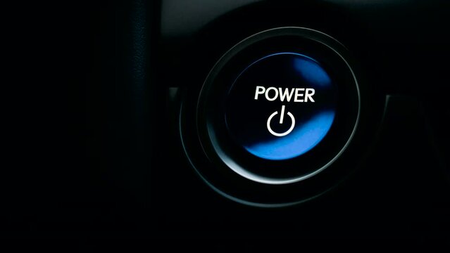 pushing blue Power ignition Button to start keyless ignition hybrid car engine