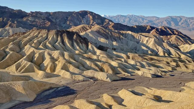 Golden sunrise at Zabriskie point at Death Valley National Park, CA, USA. Panorama  right to left.
