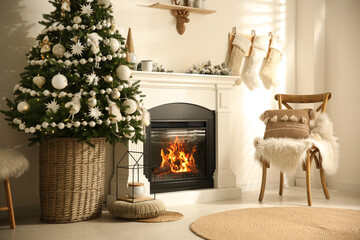 Beautiful living room interior with decorated Christmas tree and modern fireplace