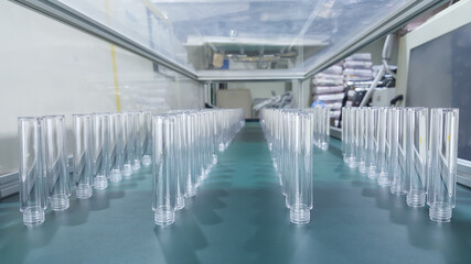 Parts of cosmetic plastic products  on the production line in industrial factory..