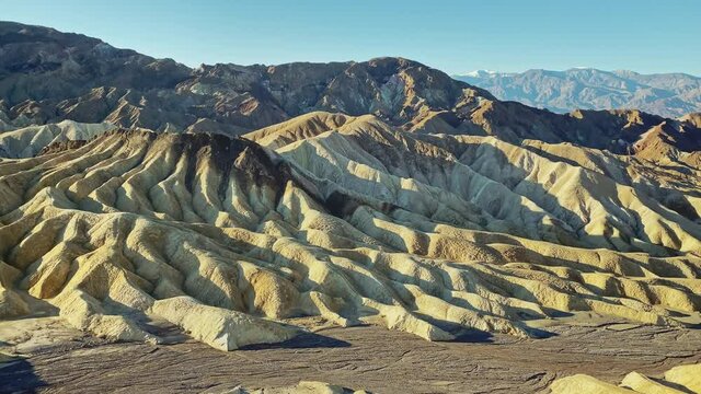 Beautiful sunrise at Zabriskie point at Death Valley National Park, CA, USA. Panorama left to right.