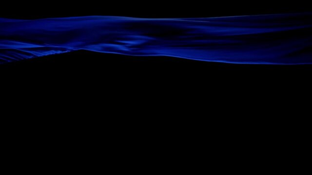 Royal Blue Silk Cloth Blown By The Wind With Black Background - studio shot