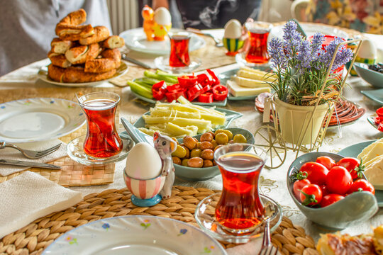 Happy Family Have Breakfast Together. Delicious Rich Traditional Turkish Breakfast Include Tomatoes, Cheese, Eggs, Bagels, Olives And Tea Cups. Ramadan Suhoor Aka Sahur (morning Meal Before Fasting). 