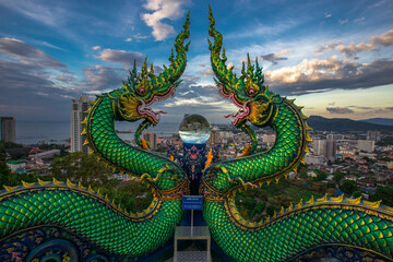 Fototapeta premium Wat Khao Phra Kru,Landmark of sriracha city with two of great Nagas guarded entrance to the view point and the crystal ball that gives an inverted view of the Sriracha scenery,Chonburi,Thailand
