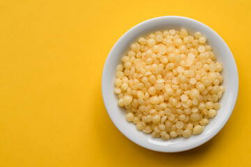 Beeswax Pellets in a Bowl