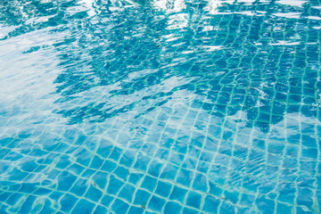 Blue ceramic tile in swimming pool for abstract background concept design