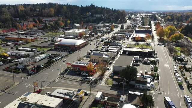 Aerial - drone footage of the commercial area near Kent Station, a shopping area downtown Kent in the Green River Valley near East Hill, Scenic Hill, Auburn, suburbs of Seattle, King County Washington