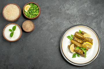 top view bowls with rice natural yogurt parsley pepper traditional azerbaijani dish dolma on dark background with copy space
