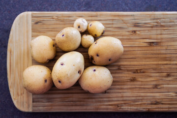 simple food ingredients,  baby potatoes on cutting board