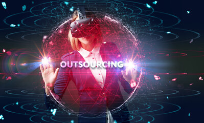 Business, Technology, Internet and network concept. Young business man writing word: Outsourcing