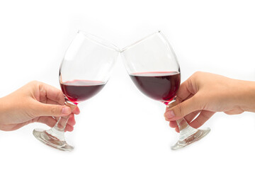 Cheer a glass of two red wine isolated