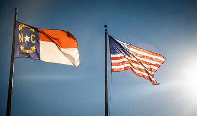 The North Carolina and American flags.