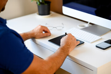 Female hands typing on laptop keyboard at the office, at home, working with tablet