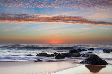 Beautiful sunrise with high cloud at the seaside