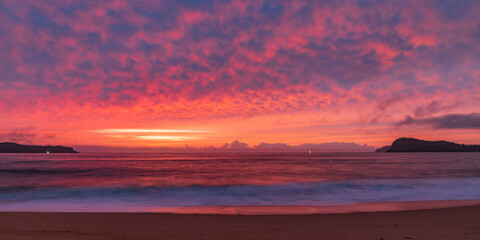 Fototapeta na wymiar High Cloud Colours Up for Sunrise Solstice at the Seaside