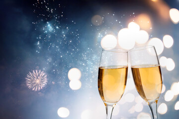 Two glasses of champagne in new year fireworks