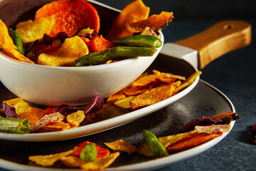 Dry fruit and Healthy vegetable chips, healthy vegan snack, a mixed heap: yellow sweet potato purple sweet potato carrot green radish green beans and shiitake mushrooms