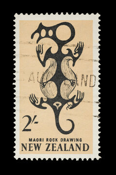 A 1960 NZ 2 shillings postage stamp featuring the "Opihi Taniwha", a piece of Maori rock art depicting a mythical water creature