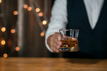 Bartender Serve Whiskey, on wood bar