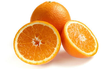 Whole and sliced ripe oranges isolated on white background