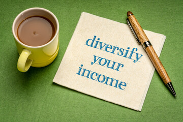 diversify your income note - writing on a napkin with a cup of coffee. business and financial concept